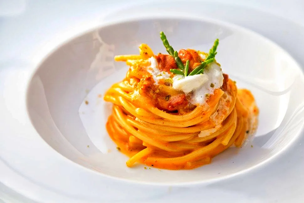 Spaghetti served in a white bowl