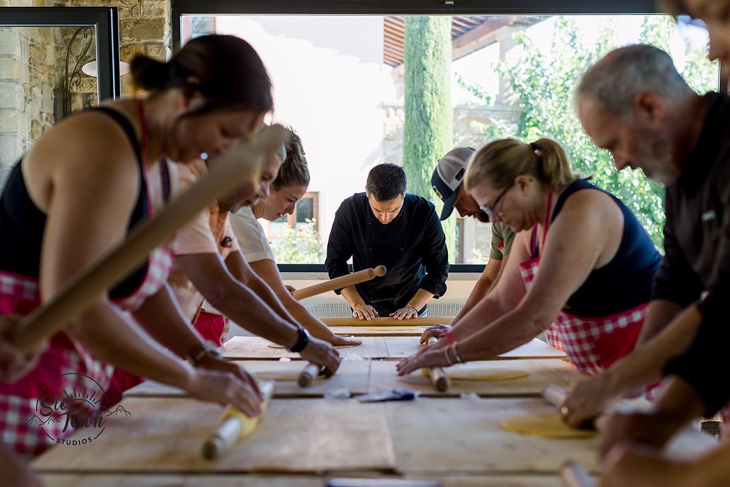 Guests learning a Tuscan cooking class